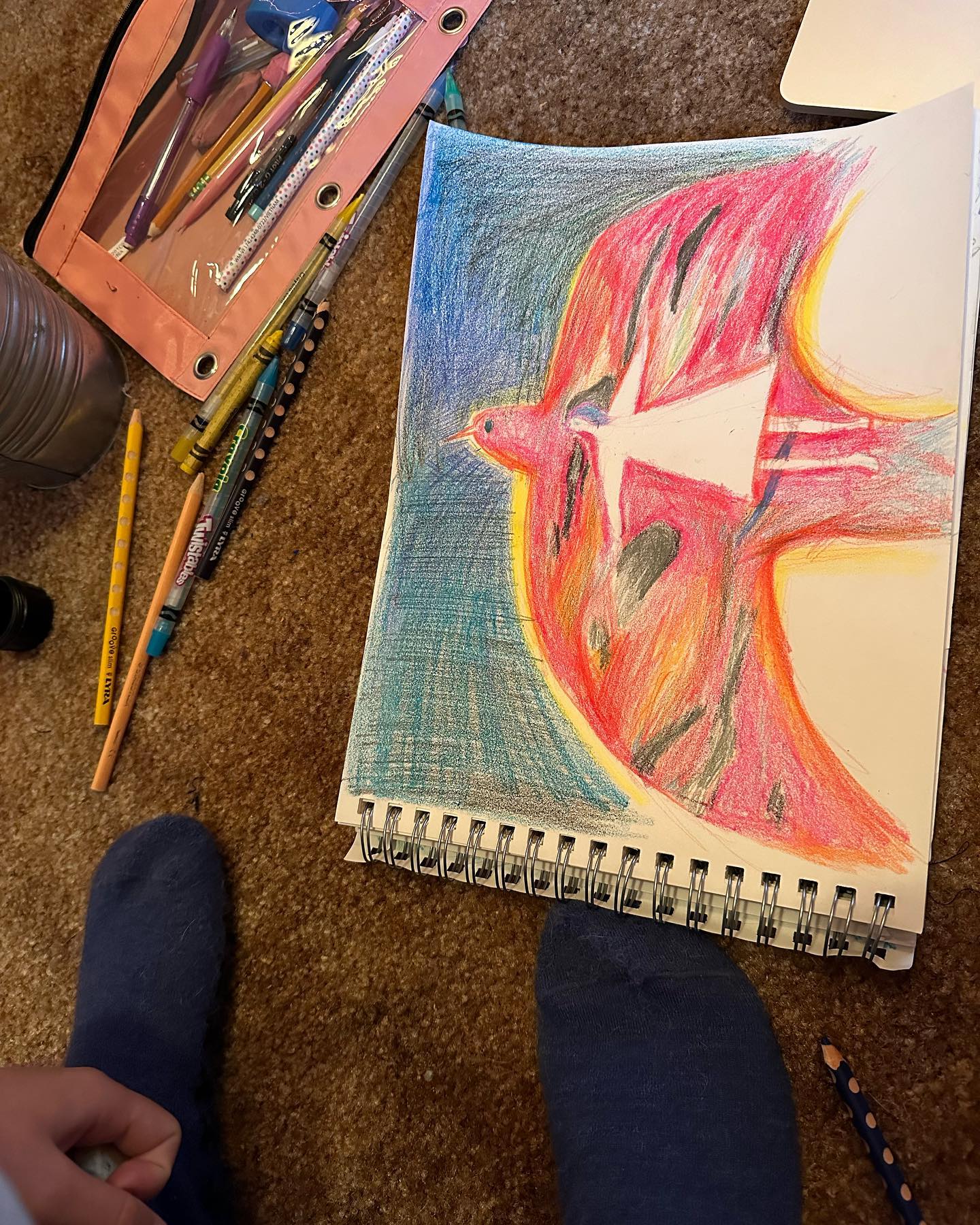 Sketchbook and supplies on floor