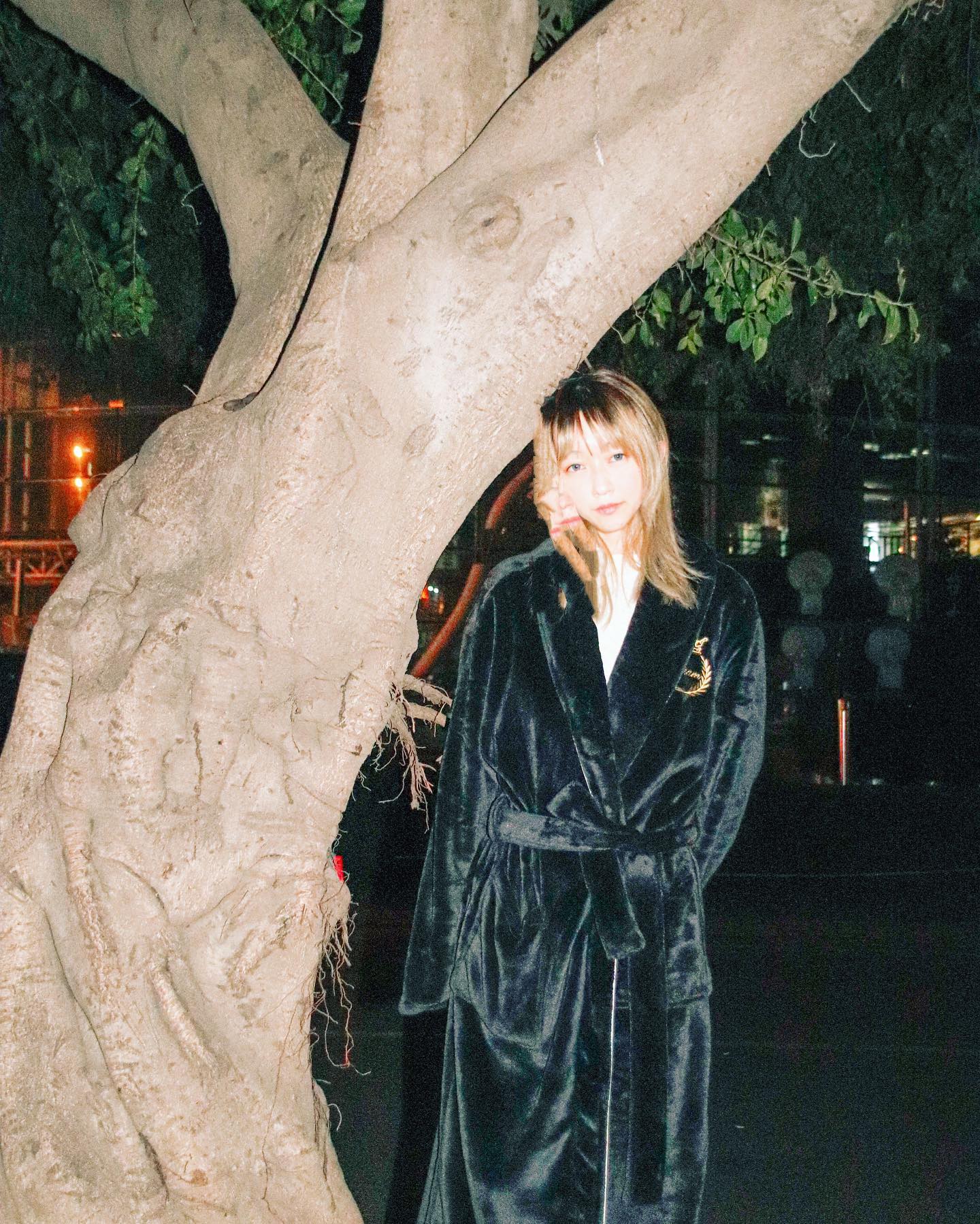 Portrait at night by tree